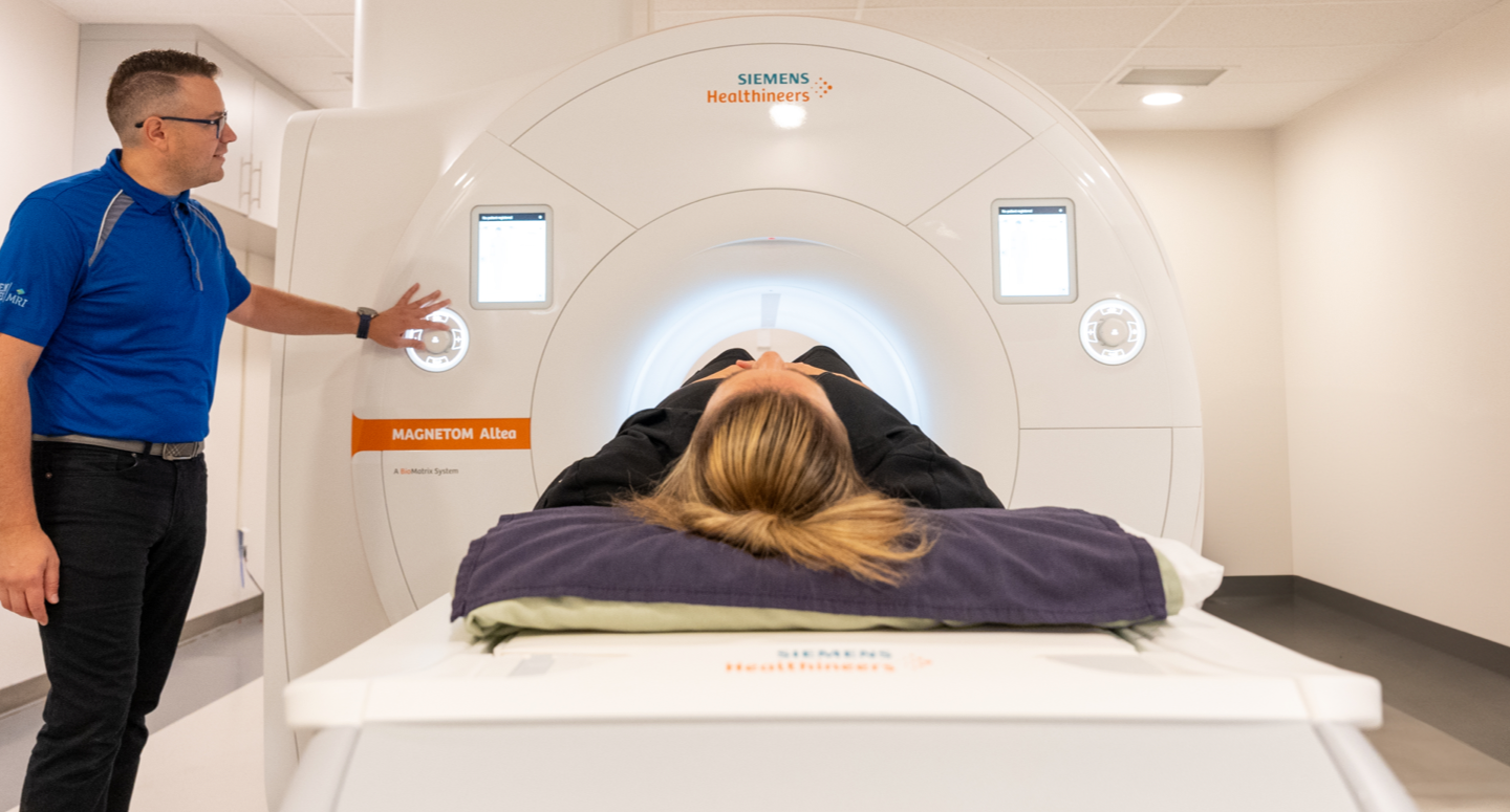 man performing an MRI to a patient