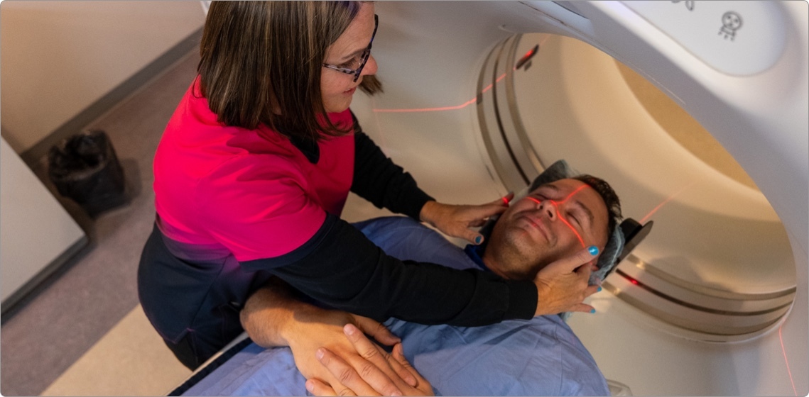 woman helping conduct an MRI