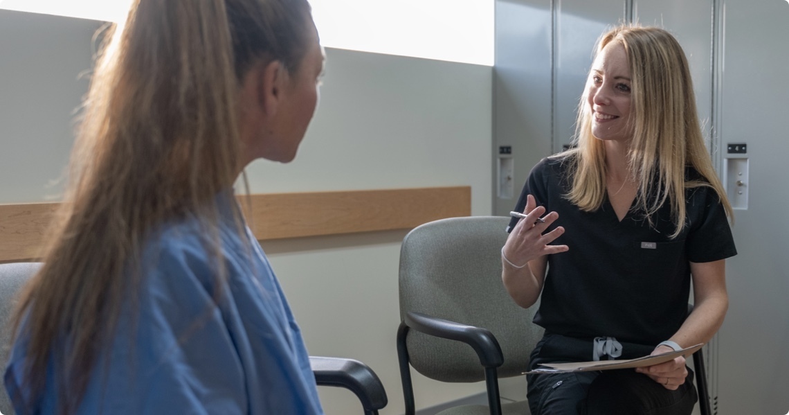 woman giving a consultation on an MRI