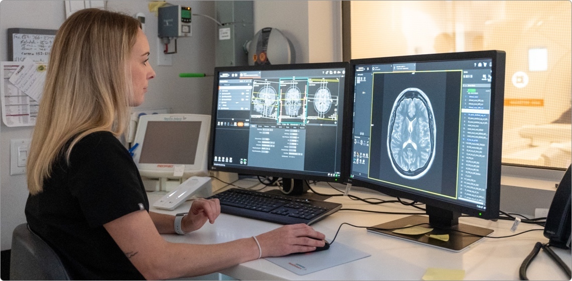 woman reviewing an MRI scan